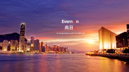 Hong Kong city scape view across the harbour towards the sunshine with words Evernoon 尚日（香港）in association with Guildhawk