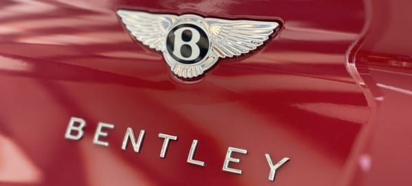 Bentley logo on red car