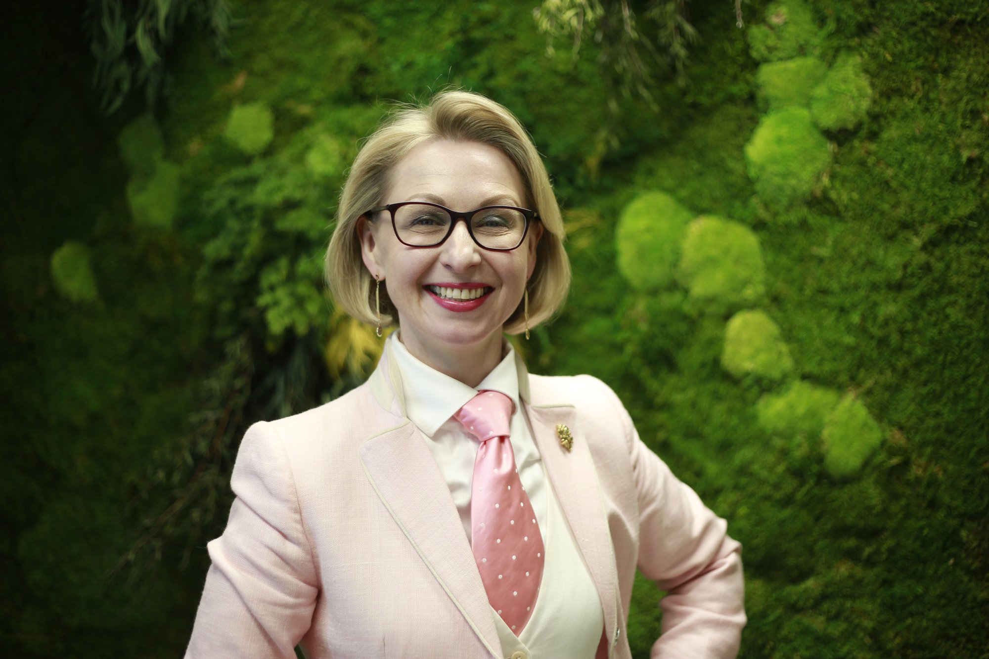 Jurga Zilinskiene against green background